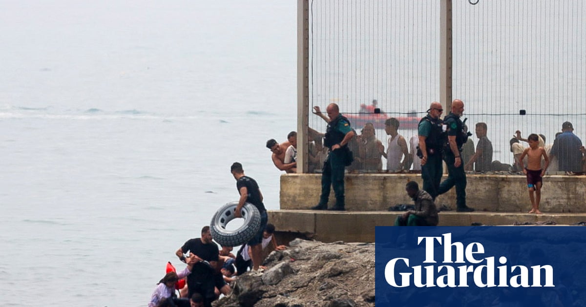Migrants enter Ceuta swimming around border barriers separating the territory from Morocco