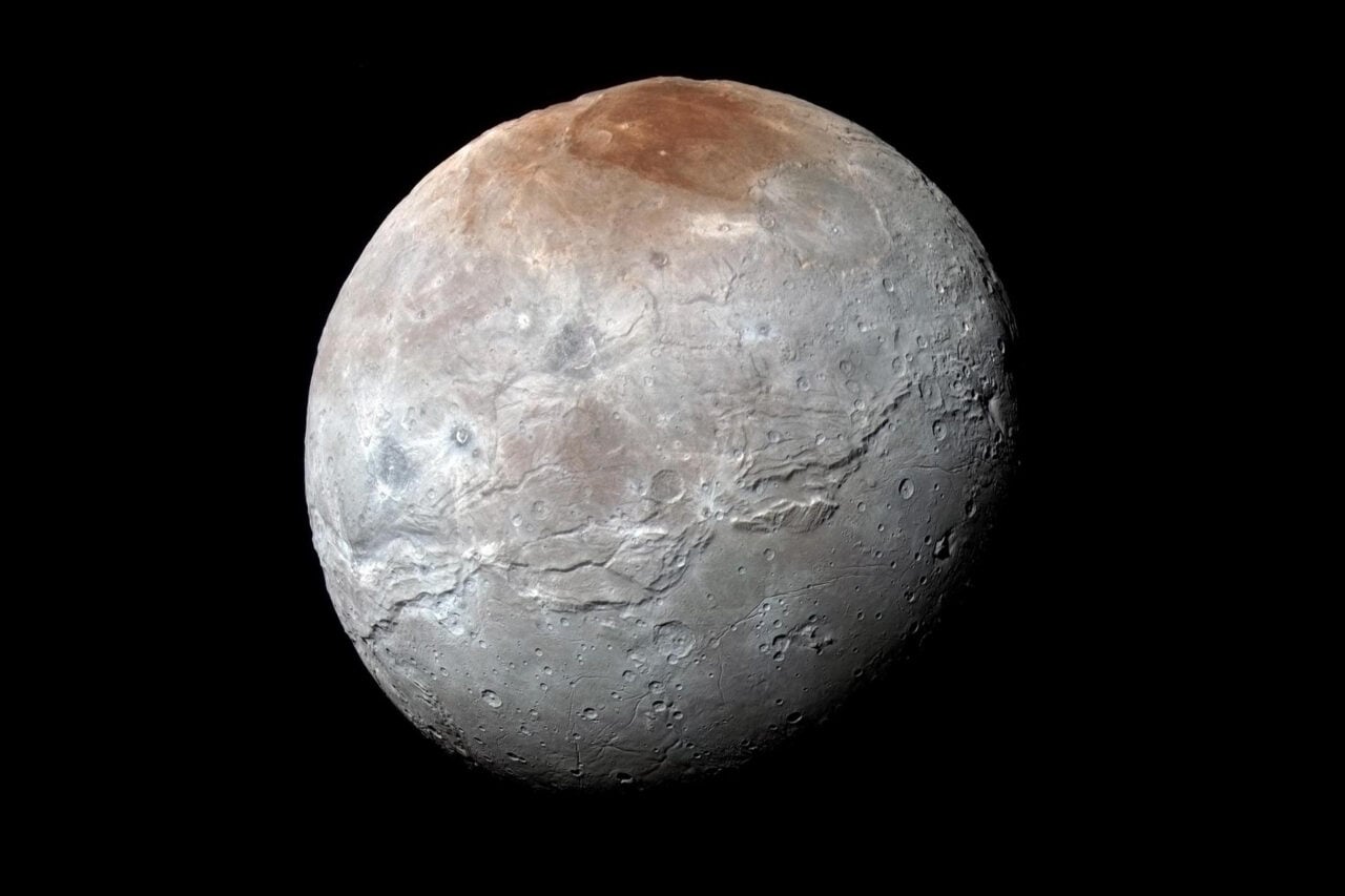 Weird Mountains on Pluto’s Largest Moon Charon Reveals a Surprising Past